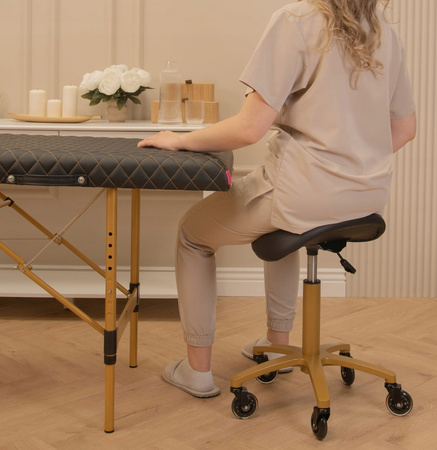 Krzesło kosmetyczne taboret typu siodło RODEO CZARNY - ZŁOTY